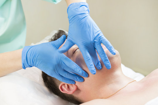 Man in the mask cosmetic procedure in spa salon