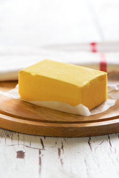 Butter block on wooden board