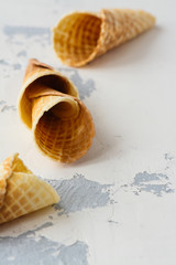 Empty waffle cones on white stone table