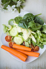 Plate of variety of vegetables, view from above, selective focus