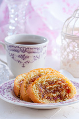 Roll with apple jam and nuts, selective focus