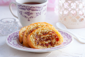 Sliced sweet roll with jam and peanuts, horizontal