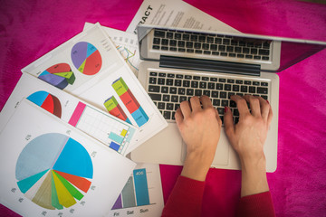 Relaxed business woman working on financial charts