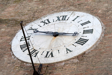 Siena, Italy. Old clock on the wall