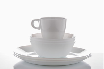 White crockery on a white background with reflections