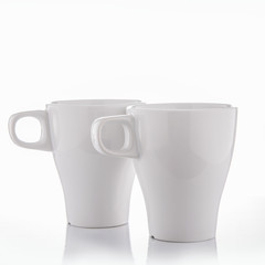 White crockery on a white background with reflections