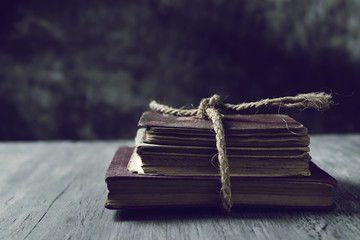 old books tied with a string