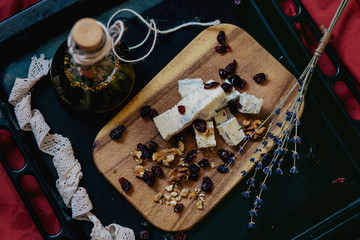 Cheese plate: cheese,  walnuts,  raisins