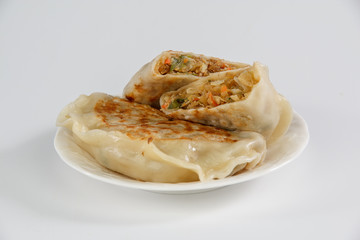 cabbage dumpling on a plate isolated on white background
