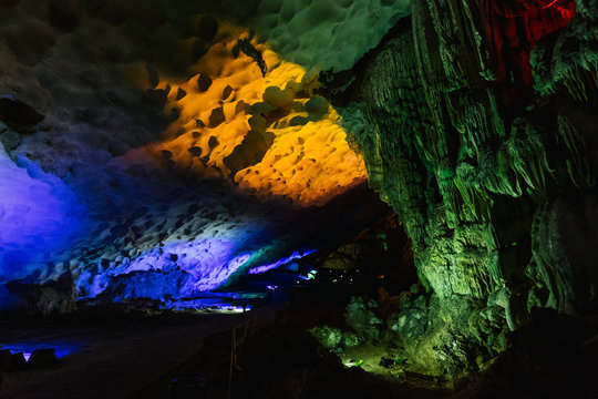 Cave illuminated with yellow lights