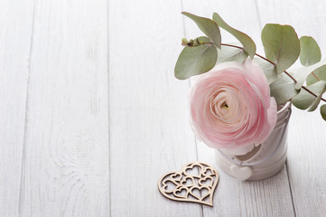 Pink ranunculus and heart
