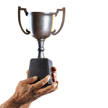 Man holding up a trophy cup