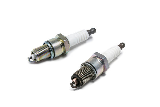 New and old spark plugs. Isolated on white background