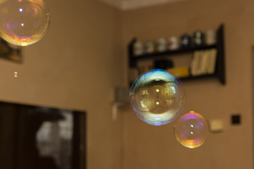 Soap bubbles flying around the room.