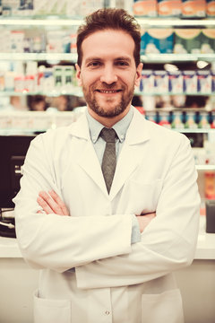 Handsome pharmacist at work