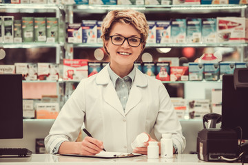 Beautiful pharmacist at work