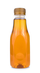Bottle of honey isolated on white