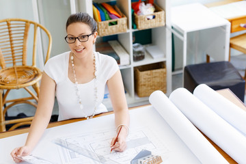 Young woman architect in office
