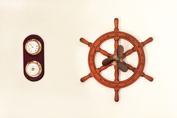 Fototapeta premium Sea wheel and propeller of a ship on a white wall