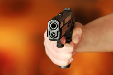 man with hand gun pistol rubber attack violence