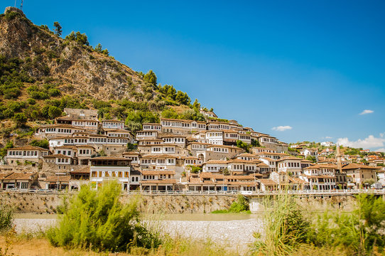 2016 Albania Berat - City of thousand windows, beautifull view of town on the hill between a lot of trees and blue sky
