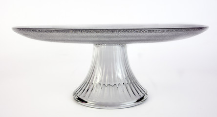 Glass cake plate on white background.