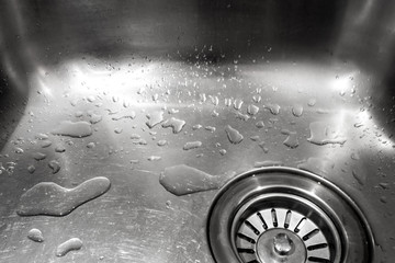Water drops in the shiny stainless sink