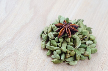 Dry aroma cardamon on the wooden board