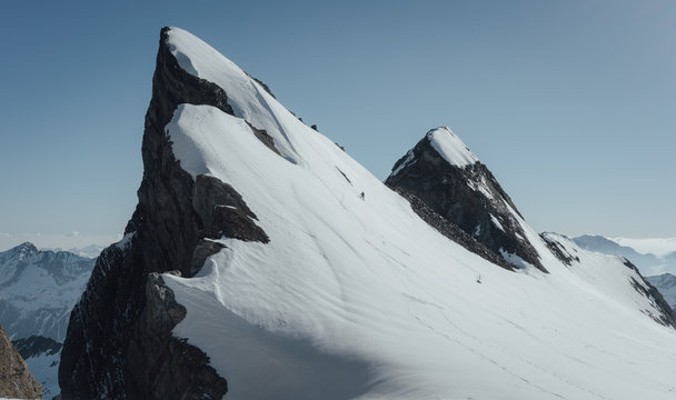 Climber descends Piton Carre in Vignemale massif