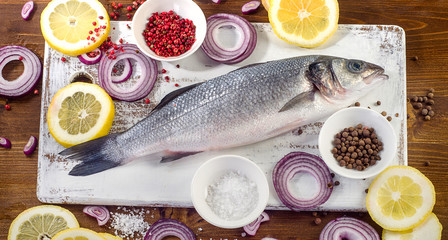 Fresh fish with  spices, salt, lemon and onion.