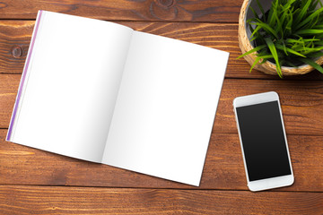 Blank book or magazine cover on wood background