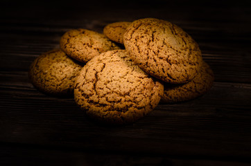 Stack of the oatmeal cookies on wooden table