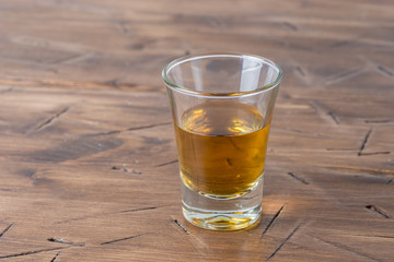 a stack of alcohol on wooden