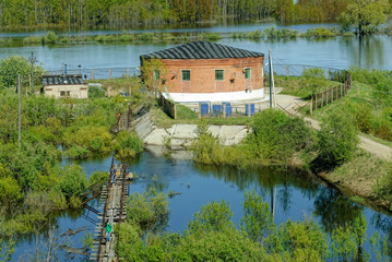 Obraz premium Tyumen, Russia - May 16, 2016: Metelevsky water intake station on Tura river. Water undergoes cleaning and comes to a city water supply system