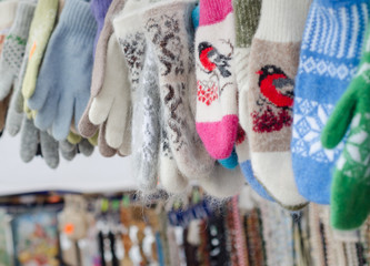 Many colorful winter gloves and mittens