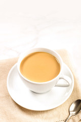Cup of coffee with milk, with place for text