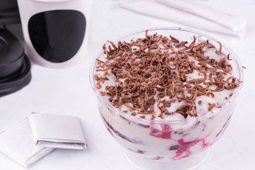 Berry shine with berries, air cream and grated chocolate
