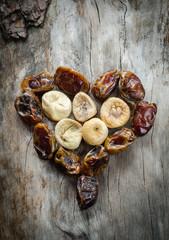 Assortment of dried figs and dates in the form of heart