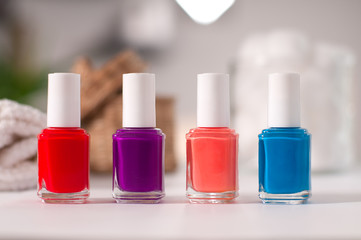 Bottles of colorful nail polish on a table