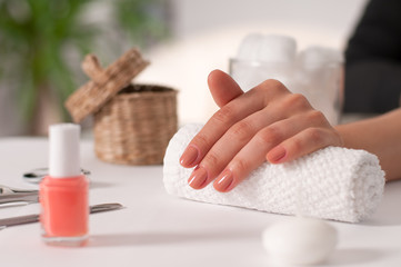  Hand care. Beautiful manicure, woman's hands in the spa