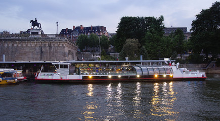 Naklejka premium Night landscape in Paris. A walk along the river Seine.