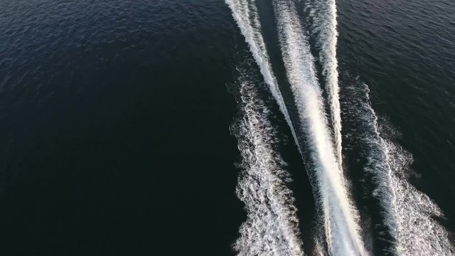 Aerial view of the wake of a boat navigating fast.