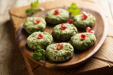 Spinach appetizer with pomegranate seeds