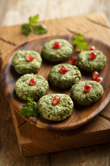 Spinach appetizer with pomegranate seeds