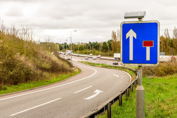 Day view background of UK Motorway Road Sign