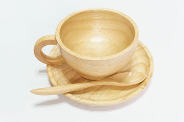 A coffee cup with spoon and plate, side view on a white background.