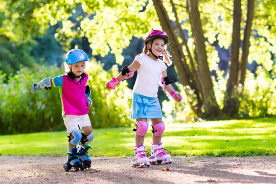 Kids roller skating in summer park