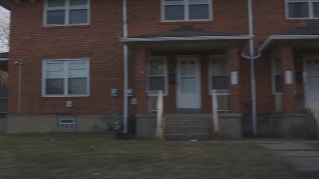 Driving Through Small Urban Town During Sunset