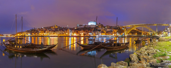 Panoramic view, traditional rabelo boats with barrels of Port wine on the Douro river, Ribeira and...
