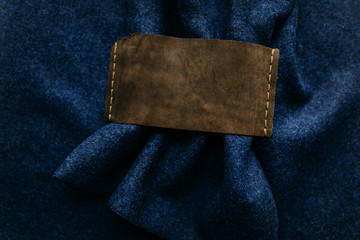 Leather tag on the wool fabric